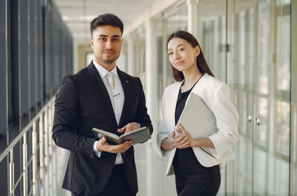 Man And Woman In Corporate Clothes