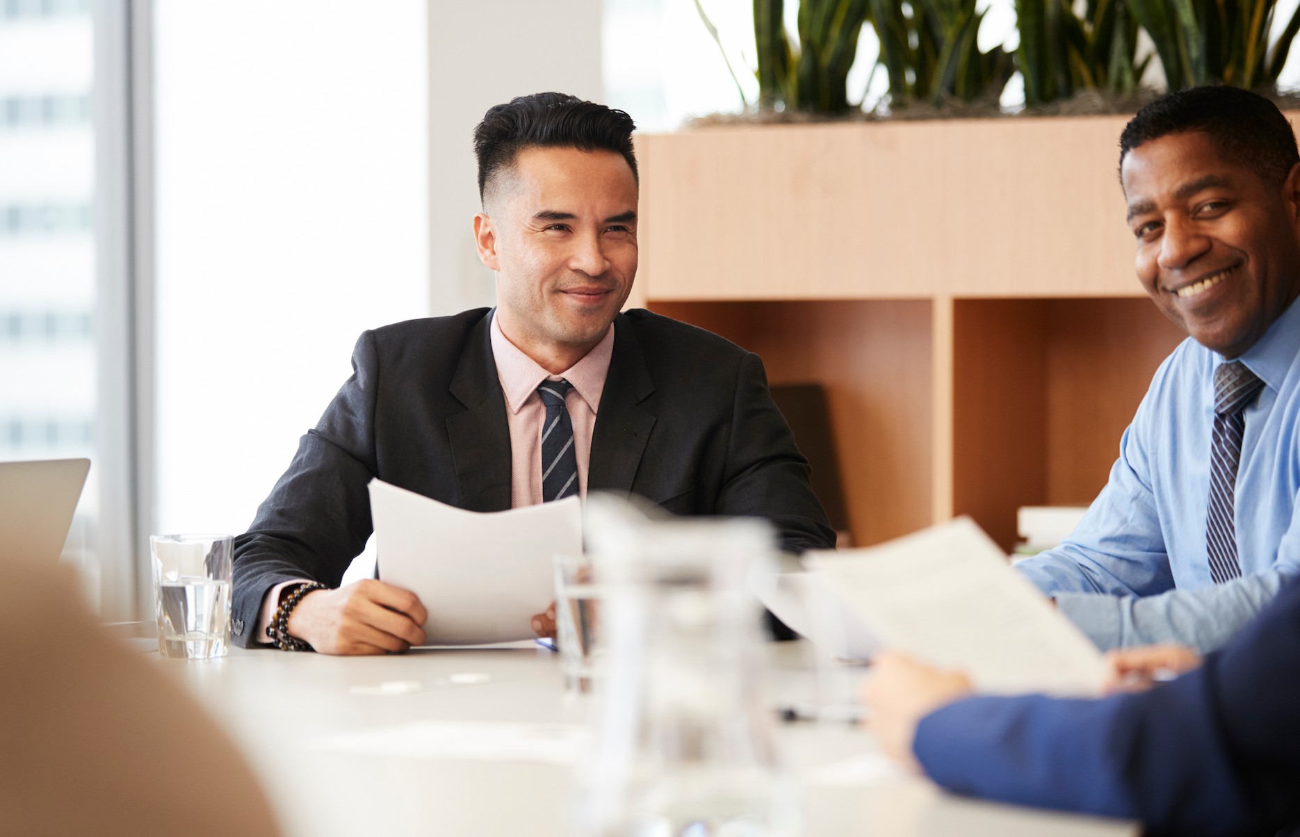 Business advisers reviewing documents during a corporate bank account application in Dubai.