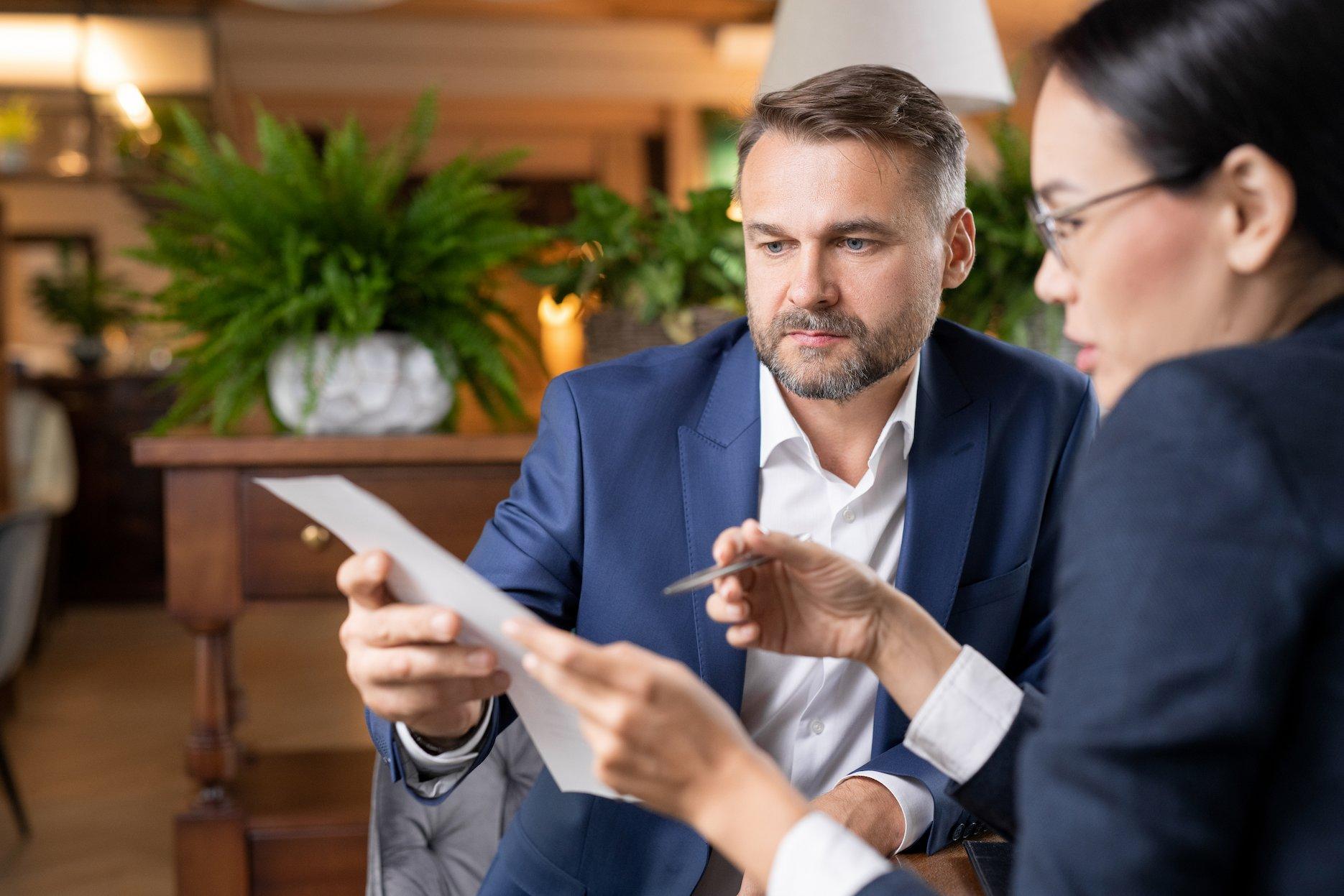A man reviewing his documents to be submitted for his UAE residence visa in Dubai.