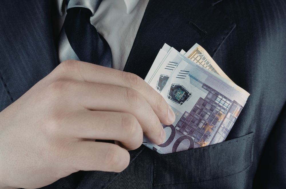 Man Pocketing Money