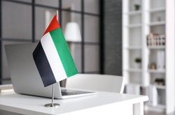 Business Office With UAE Flag On Desk
