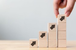Building Blocks Showing Upward Formation Of A Company