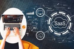 SaaS Diagram With Person On Laptop