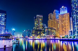 UAE Cityscape At Night Over Water