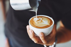 Latte Art By Barista On Coffee In Small Cup For Cafe Business