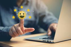 Customer On Laptop With Smiley Face