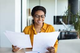 Professional reviewing employment contract documents for UAE labour law compliance and onboarding.