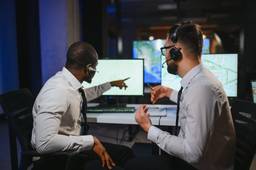 IT professionals monitoring network systems and managed technology services.