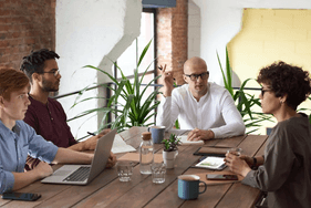 Stock Photo People Working A Table