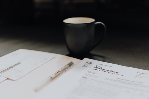 stock photo tax residency certificate forms and a pen