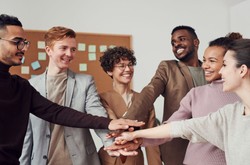 A Diverse Team High-Fiving