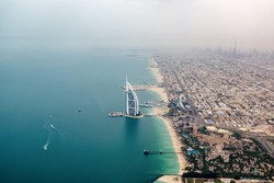 A stock photo of Dubai showing the business city hub and suburbia and the waterfront 