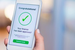 Phone Showing A Loan Application Approval Message