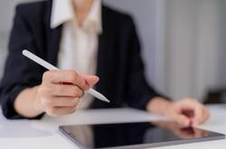 Person Signing A Document