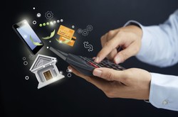 Man Holding Calculator With Bank items And Phone Coming Out Of It