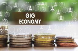 Coins And Title Saying "Gig Economy"