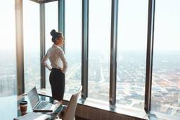 Businesswoman in a Dubai office planning the next stage of company growth.