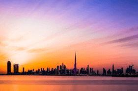 Sunset over Dubai cityscape stock photo.