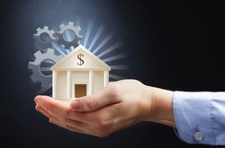 Man's Hands Holding Model Bank