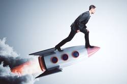 Man On Rocket Showing Startup Business 