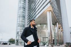 Man With Laptop At Building