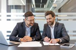 Founders reviewing business structure options in a Dubai office.
