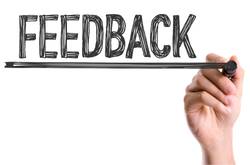 Person Writing Word Feedback