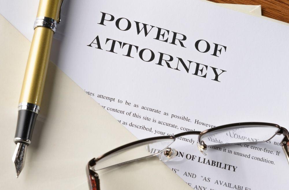 Power Of Attorney Paperwork And Glasses