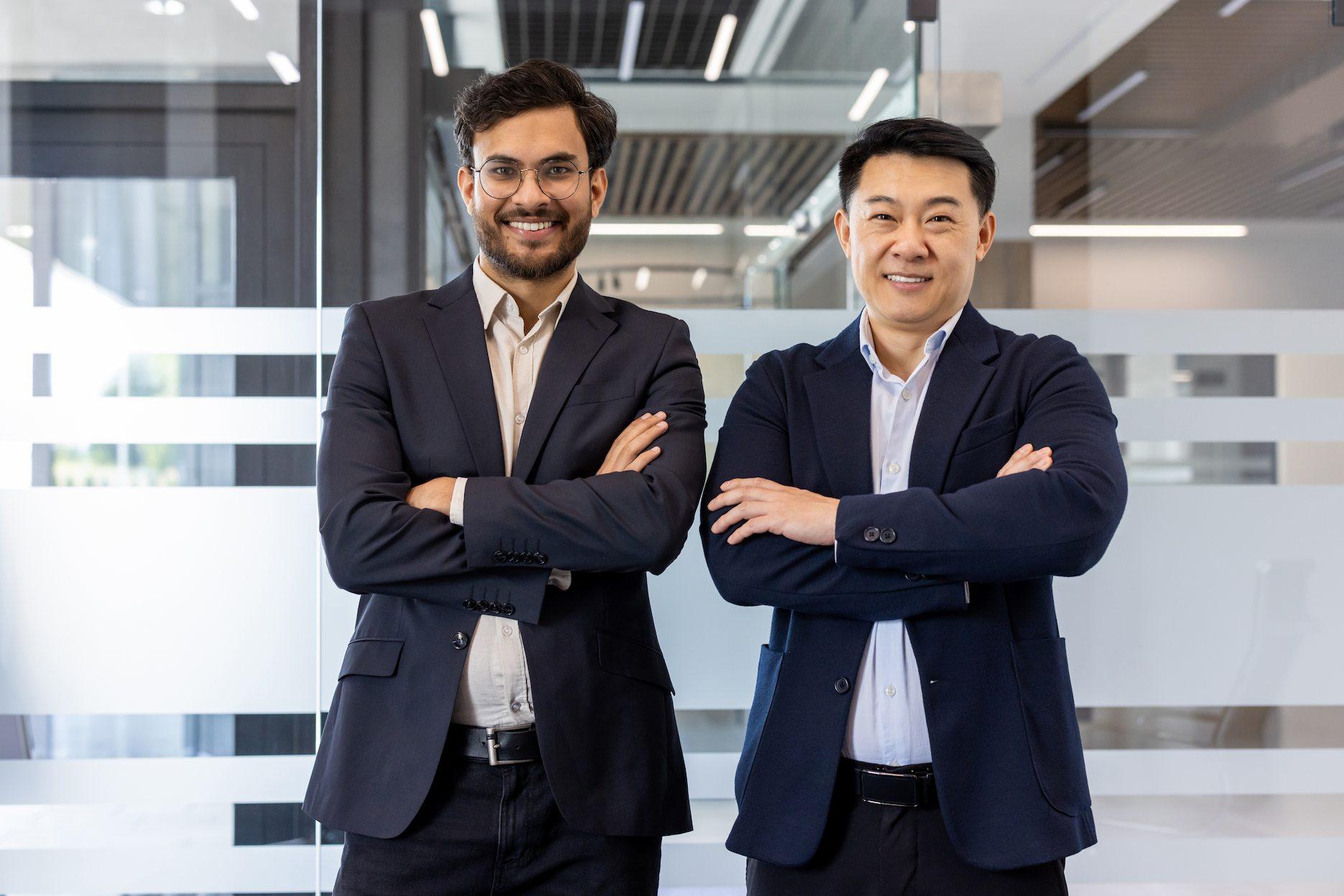 Business founders in a modern office planning business setup in Dubai.