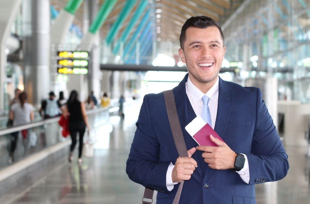 Man At Airport With Visa And Ticket